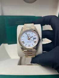 Side view of Rolex golden watch showing premium chain strap